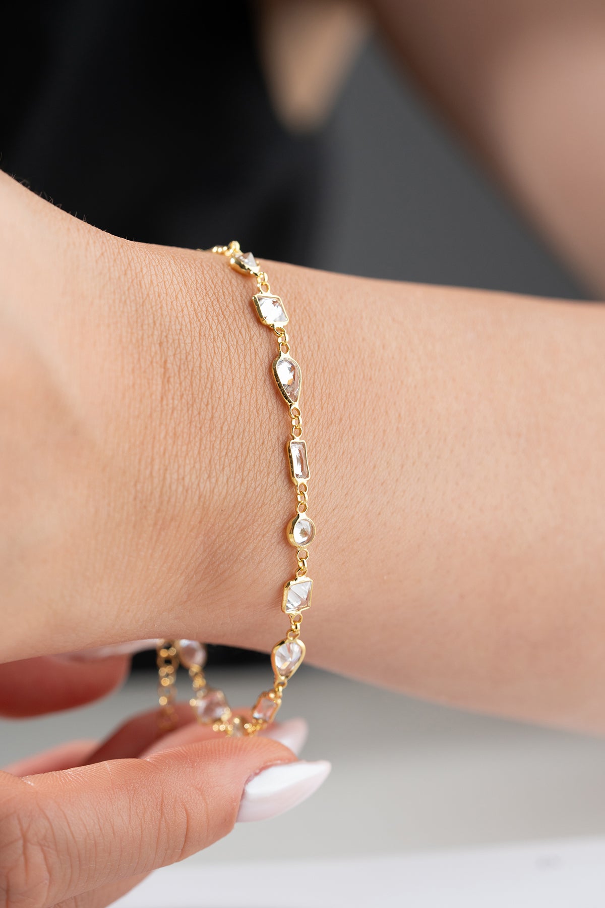 Gilt bracelet with geometric stones