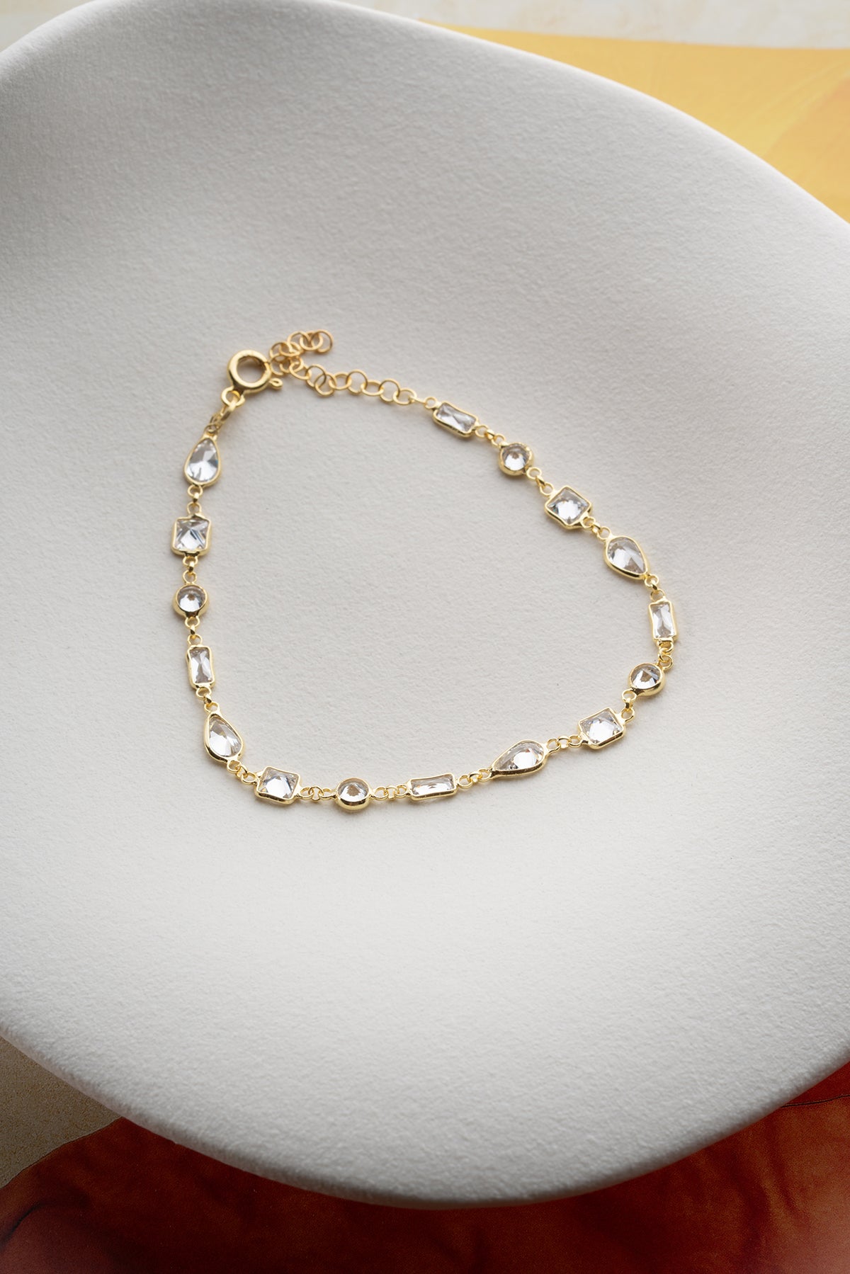 Gilt bracelet with geometric stones