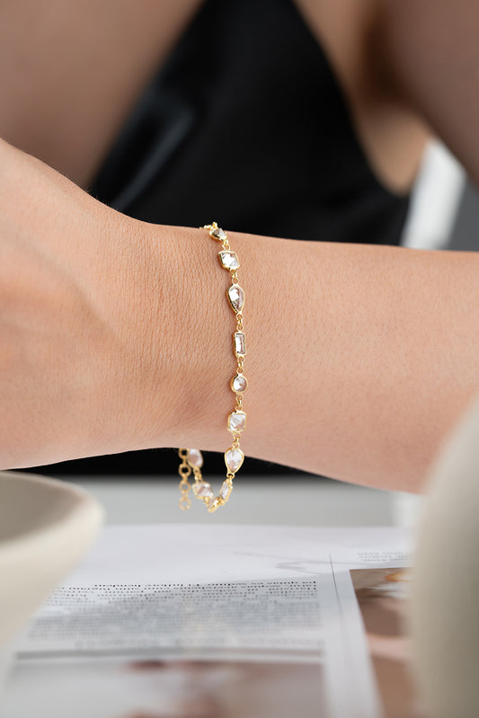 Gilt bracelet with geometric stones